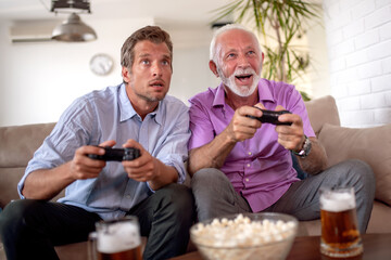 Father and son play video game