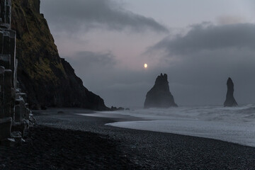 Moonlight above black sand beach of Reynisfjara, Iceland