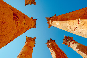 Looking up at ancient Roman columns in the city of Jerash, Jordan