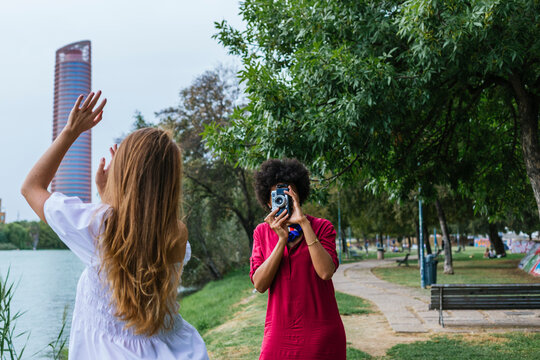 Friends Taking Photos To Each Other