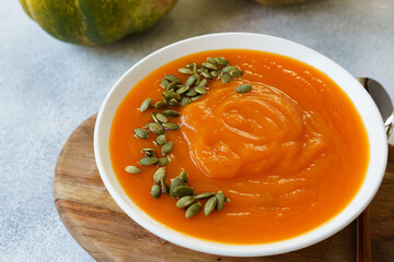 Close up photo of pureed pumpkin soup with pumpkin seeds