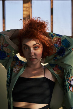 Young alternative redhead girl's portrait with green eyes