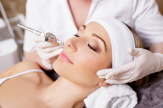 Cosmetology And Beauty Concept - Woman Getting Facial Oxygen Anti-aging Procedure In Beauty Salon