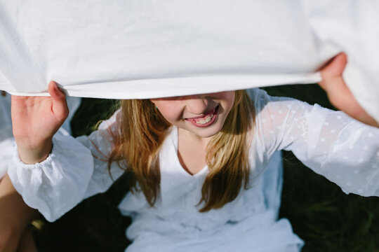 the smile of a child playing hide and seek