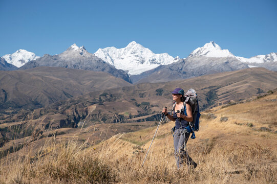 One woman with a backpack hiking around Huaraz with Cordillera Blanca