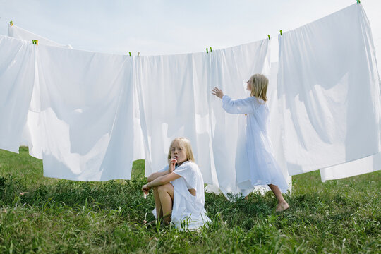 children in the village help their parents wash