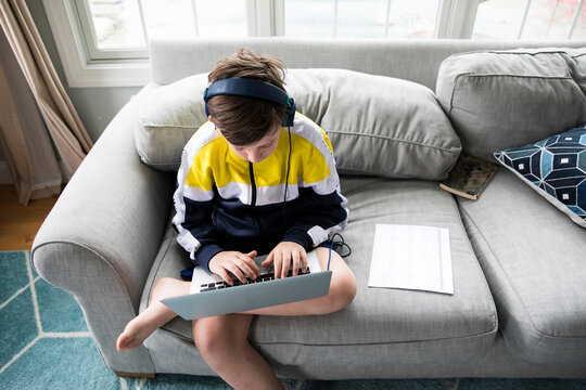 Overhead View of Tween Boy Using Laptop for Distance Learning