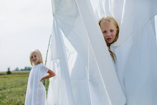 children in the village play hide and seek among the washed white line