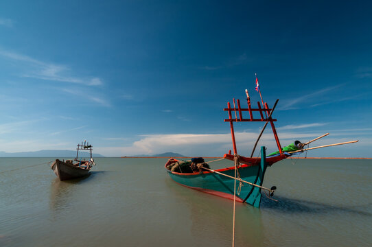 Simple fishing boats in port. Kampot province, Cambodia.