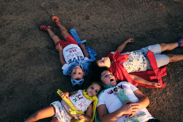 children disguised as superheroes pretend to be dead after the pitched