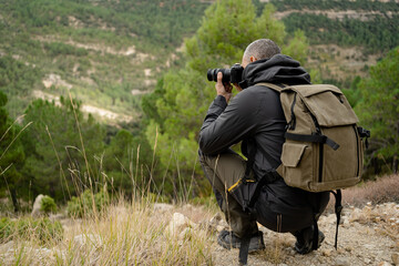 caucasian man Traveler with photo camera and backpack