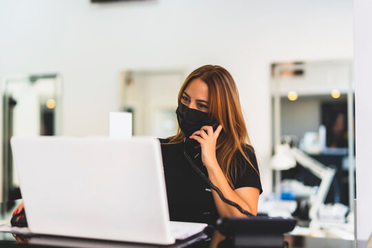 enterprising woman working with her computer from her business