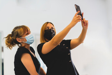 friends taking a selfie from their smartphone