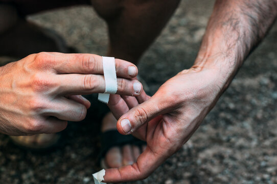 Put tape on your fingers for climbing.