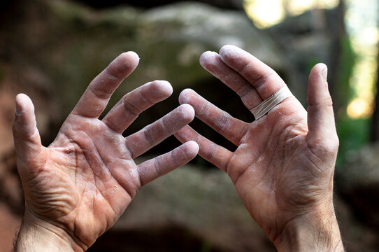 Climber hands, hard, after the effort.