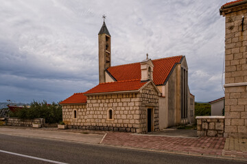 Church in Zadvarje, Croatia. August 2020, cloudy day