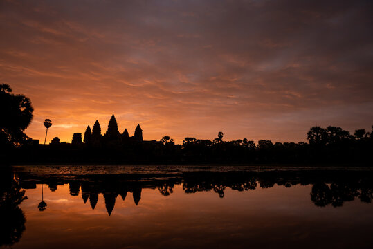 Angkor Wat, Siem Reap, Cambodia. Sunrise from reflection pool showing 5 towers of main temple.
