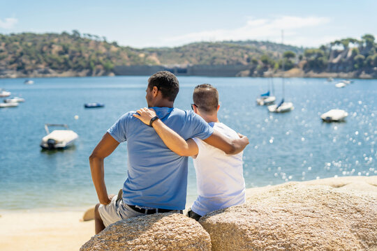gay couple hugging by the sea