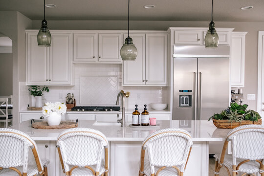 Horizontal portrait of a clean white kitchen