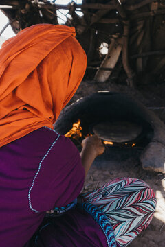 
Berber Woman Making Artisan Bread In The Desert