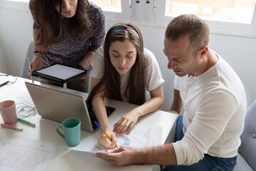 Smart coworkers analyzing business report charts together