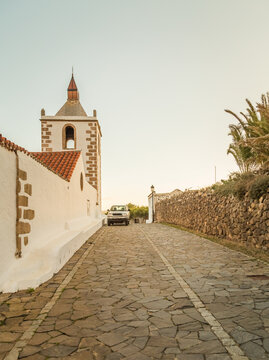 Parked car in stone path  leading downhill in Betancuria in Fuerteventura, Canary Islands, Spain.