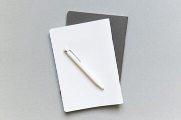 white lies notebook the gray notebook in the form on a white background with white handle closeup