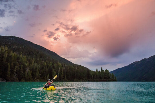 Man paddling inflatable packraft on Cheakamus Lake, Whistler, B.C.