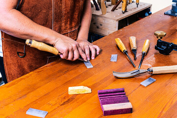 Wood craftswoman sharpening tool with stone