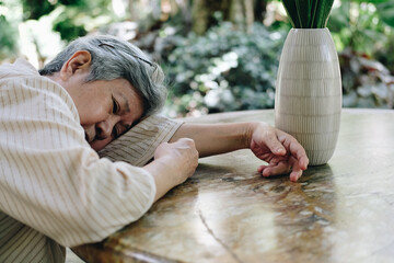 stressed depressed fatigued sad upset asian old asian elderly senior elder woman