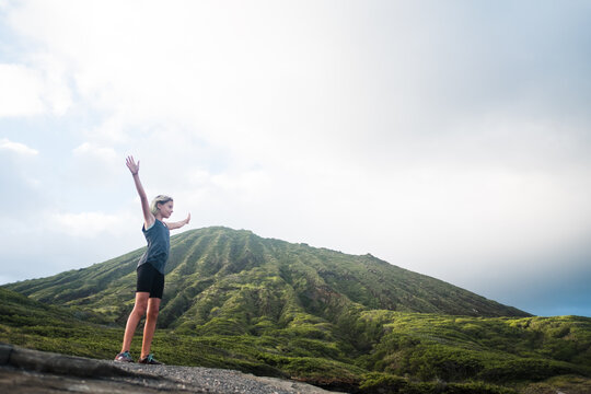girl stands at the lanai lookout in hawaii