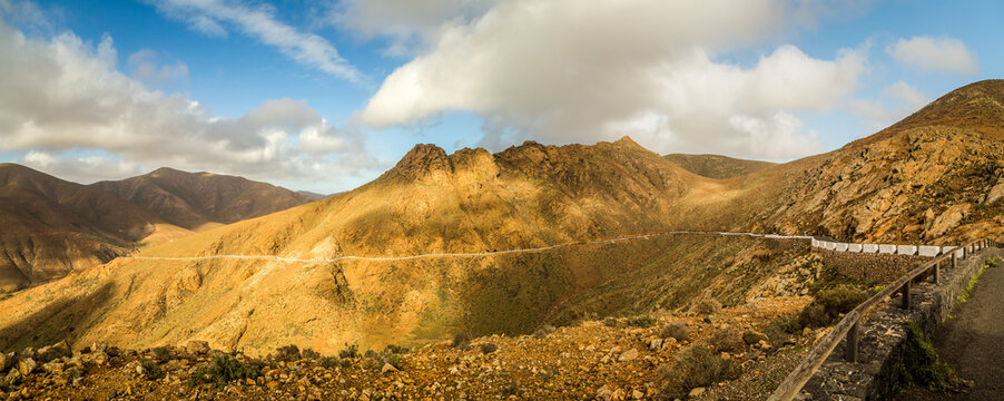 Rocky hill landscape with winding road in Fuerteventura, Canary Islands, Spain.