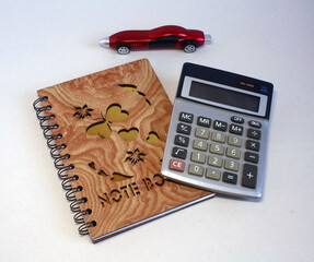 Notebook calculator and fountain pen are necessary attributes of a businessman.