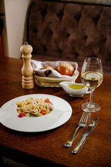 Plate with delicious Chicken Alfredo on table