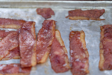 Cooking bacon in a restaurant kitchen