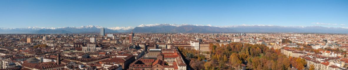 Panoramic view over Turin city with the snow covered Alps in the background