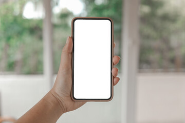 Women's hands holding cell telephone blank copy space screen. smart phone with technology concept