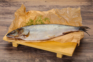 Salted herring over the wooden board