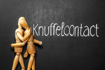 The inscription on the niderladskom language hugs. Hug concept. Drawing on a chalkboard. Support...