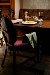 spaghetti with cheese and egg on a white plate