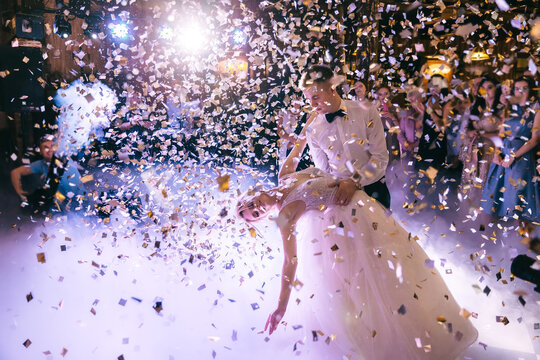 Lots Of Confetti Fall Over Wedding Couple Dancing On The Porch.