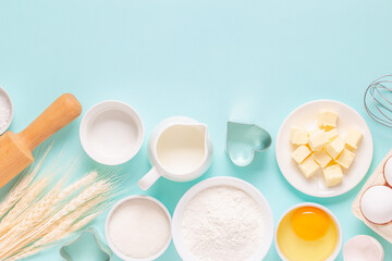 Ingredients for baking on light blue background.