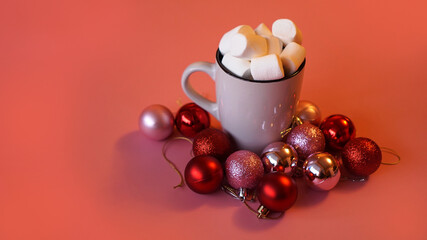 Trendy Christmas background of of hot chocolate with marshmallow, decorated with balls on pink