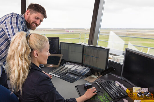 Male and female dispatchers working together