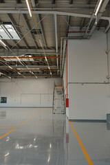 New  resin floor coating and marking signs in a car workshop.