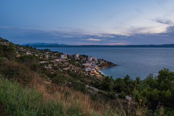 Drasnice is a tourist locality or village in southern Dalmatia, Croatia, located between Makarska and Podgora and underneath the Biokovo mountains. Top view at sunset. September 2020