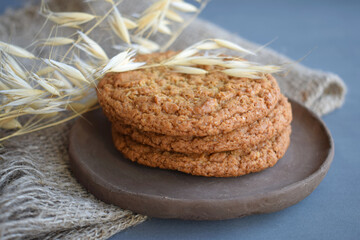 Oatmeal cookies and ears of corn on a clay plate.Delicious and healthy Breakfast.