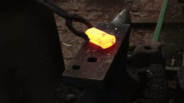 blacksmith forging an axe.
