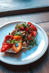 Appetizing bruschetta on a white plate. restaurant server