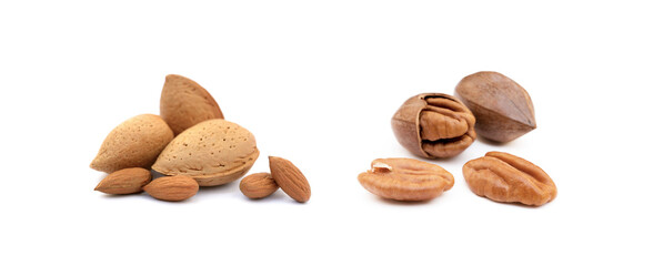 Heap of almonds in shells and pecan nuts  isolated on white background